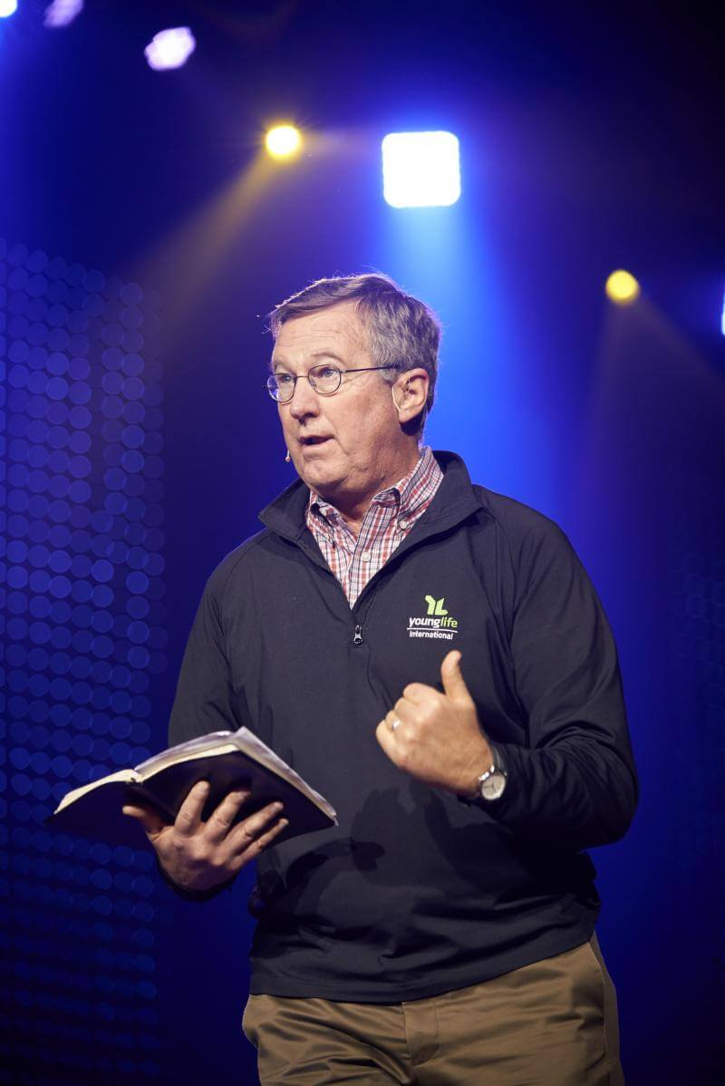 Photo of man speaking with Bible